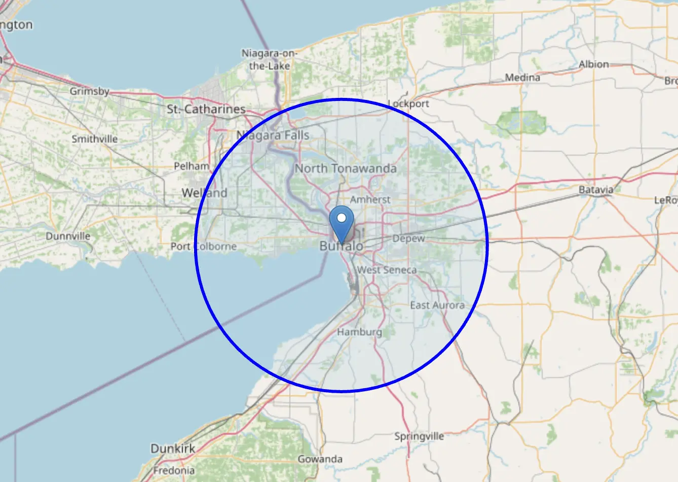 Map of the Buffalo area with a blue circle marking the service radius, covering Cheektowaga, Amherst, Tonawanda, West Seneca, and more